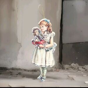 Vintage Hardboard Paper Ornament Girl Holding Doll